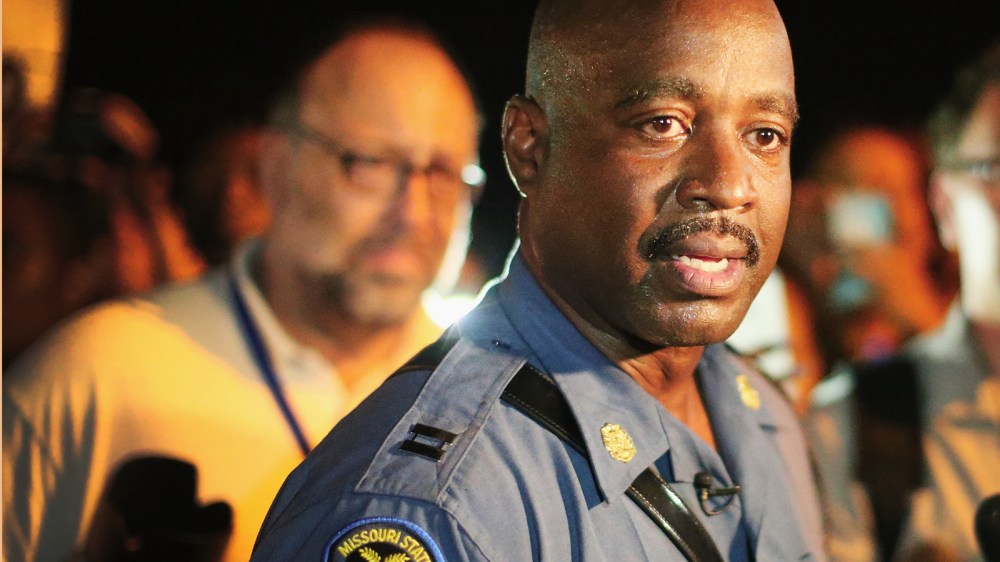 Capt. Ronald Johnson of the Missouri State Highway Patrol, who was appointed by the governor to take control of security operations in the city of Ferguson, walks among demonstrators gathered along West Florissant Avenue on August 14, 2014 in Ferguson, Mi