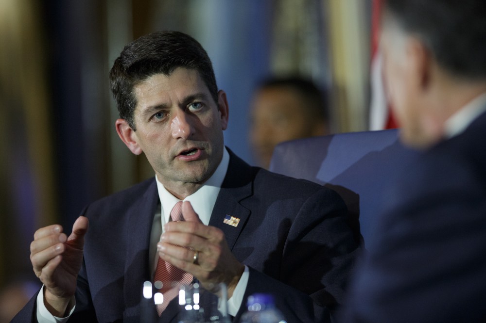 U.S. Rep. Paul Ryan (R-WI) answers a question while he is interviewed by former Republican presidential candidate Mitt Romney in Chicago, Aug. 21, 2014.