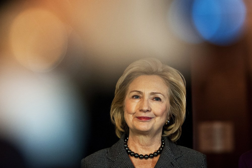 Hillary Clinton listens to a speaker before receiving the 2013 Lantos Human Rights Prize in Washington, Dec. 6, 2013.