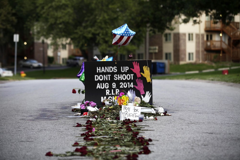 Roses line the street leading to a makeshift memorial for Michael Brown on Aug. 22, 2014 in Ferguson, Mo.