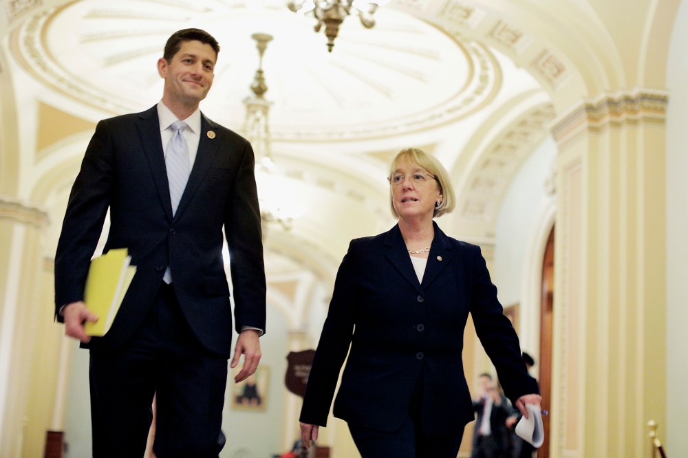 House Budget Committee Chairman Paul Ryan (R-WI) and Senate Budget Committee Chairman Patty Murray (D-WA) walk past the Senate chamber on their way to a press conference to announce a bipartisan budget deal, the Bipartisan Budget Act of 2013, at the U.S.