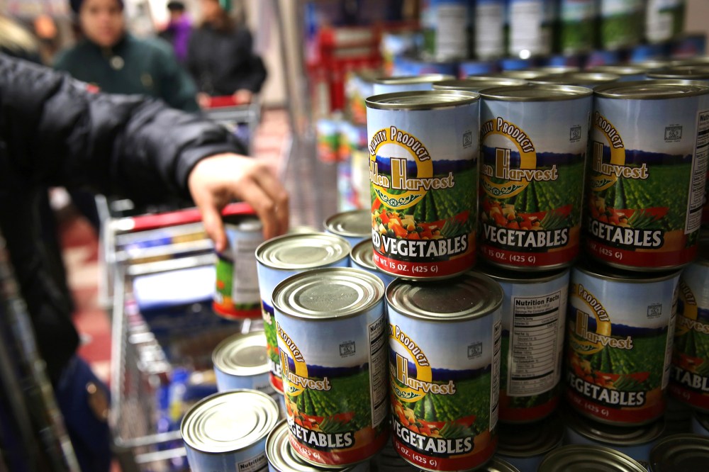 Harlem residents choose groceries at the Food Bank For New York City, Dec. 11, 2013. in New York, N.Y.