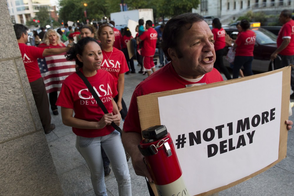 Immigration activits protest President Barack Obama's immigration policies in Washington, DC, Oct. 2, 2014.