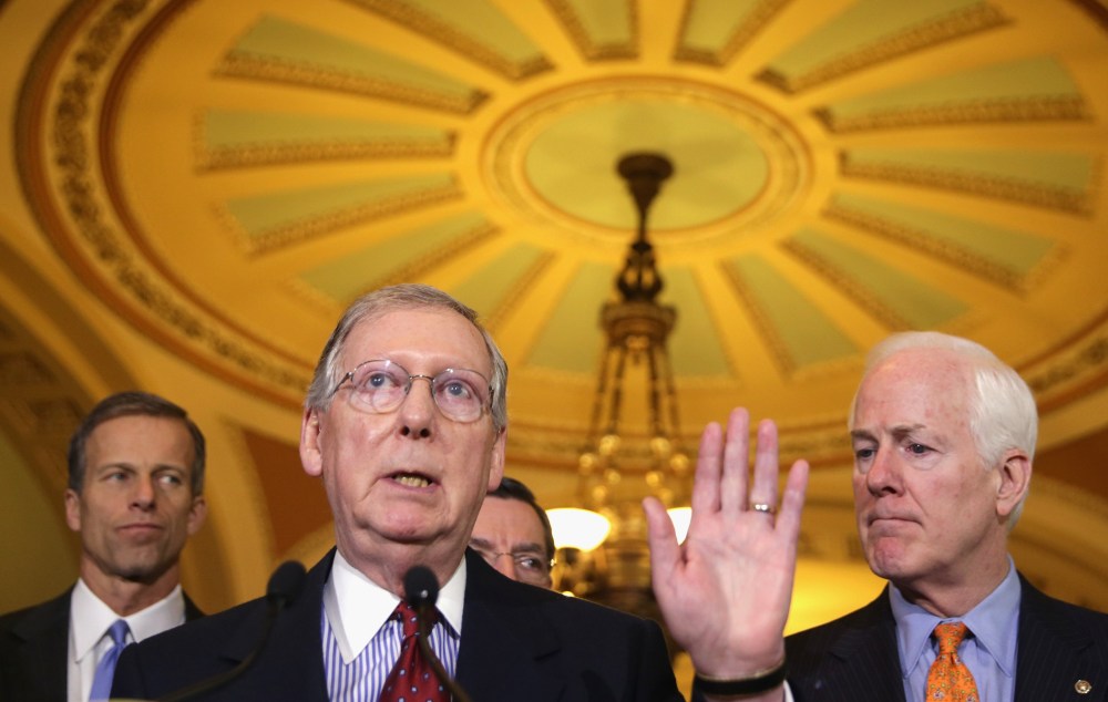 Senate Minority Leader Sen. Mitch McConnell speaks to members of the media after the weekly Senate Republican Policy Committee luncheon on December 17, 2013 on Capitol Hill in Washington, D.C.