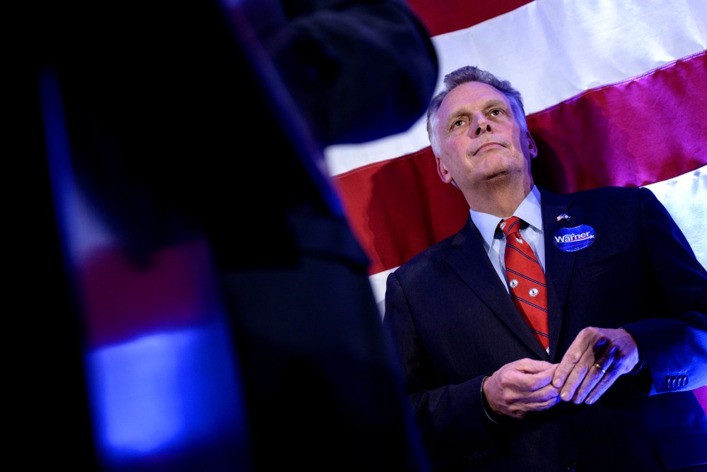Virginia Governor Terry McAuliffe listens as midterm election results are announced during an election night rally Nov. 4, 2014 in Arlington, Virginia. (Photo by Brendan Smialowski /AFP/Getty)