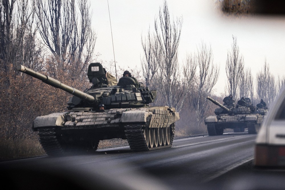 A column of tanks drive from a rebel-territory to Donetsk near the town of Shakhtarsk, eastern Ukraine on Nov. 10, 2014. (Photo by Dimitar Dilkoff/AFP/Getty)