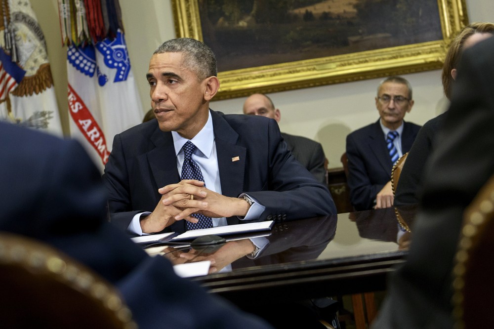 President Barack Obama waits before a meeting at the White House on Nov. 18, 2014 in Washington, D.C. (Photo by Brendan Smialowski/AFP/Getty)