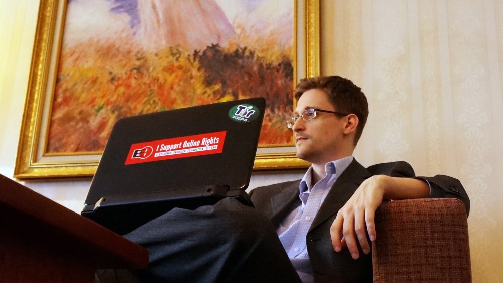 Former intelligence contractor Edward Snowden poses for a photo during an interview in an undisclosed location in Moscow, Dec. 2013.