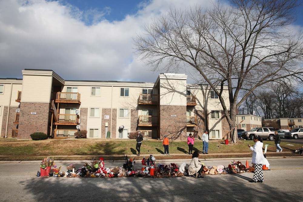 People visit the Michael Brown memorial in the Canfield Green Apartments on Nov. 27, 2014 in Ferguson, Mo. (Photo by Scott Olson/Getty)