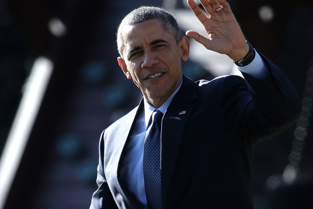 U.S. President Barack Obama waves as he departs the White House on Dec. 15, 2014 in Washington, DC.