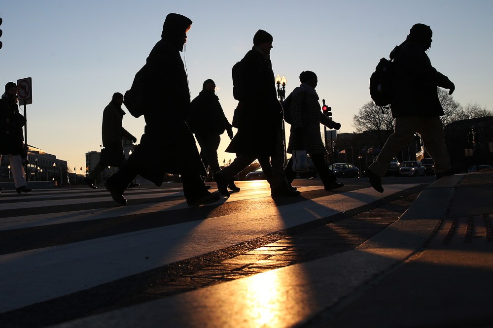 Commuters brave the frigid temperature as they cross the street on Capitol Hill, Jan. 7, 2014 in Washington, D.C.