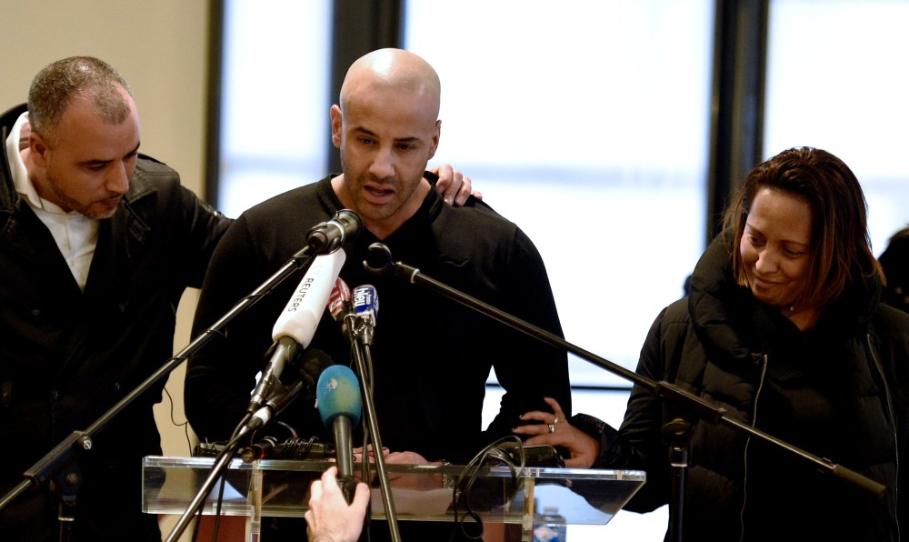 Malek Merabet (C), brother of slain policeman Ahmed Merabet, during a press conference in Livry-Gargan, a Paris suburb, on Jan. 10, 2015 with Ahmed's brother-in-law Lotfi Mabrouk (L), and Ahmed's partner Morgane. (Photo by Martin Bureau/AFP/Getty)
