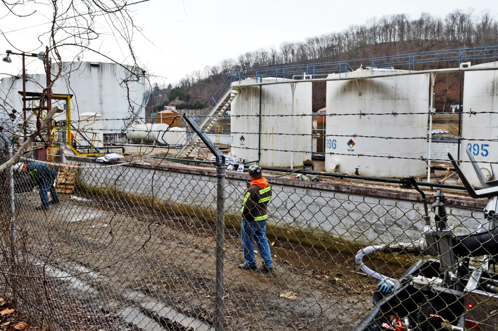 Leaking MCHN tanks at Freedom Industries are being off loaded into tanker trucks in Charleston, West Virginia, Jan. 10, 2014.