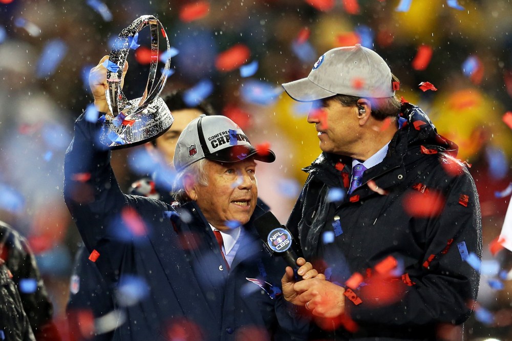 New England Patriots owner Robert Kraft holds up the Lamar Hunt Trophy after defeating the Indianapolis Colts in the 2015 AFC Championship Game at Gillette Stadium on Jan. 18, 2015 in Foxboro, Mass. (Photo by Jim Rogash/Getty)