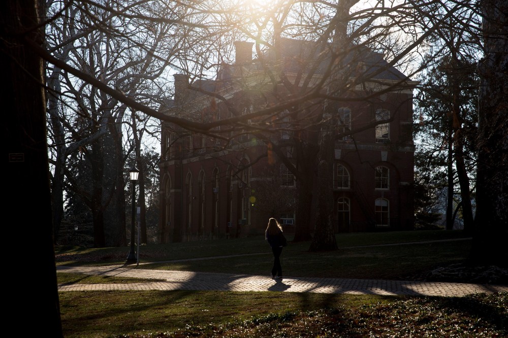 A student walks near Brooks Hall on the University of Virginia campus in Charlottesville, Va., on Jan. 17, 2015. (Photo by Andrew Harrer/Bloomberg/Getty)