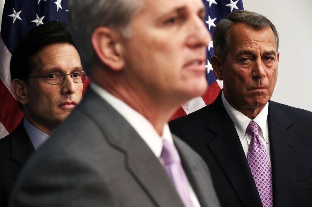 Kevin McCarthy, John Boehner, and Eric Cantor listen during a news briefing on Jan. 14, 2014.