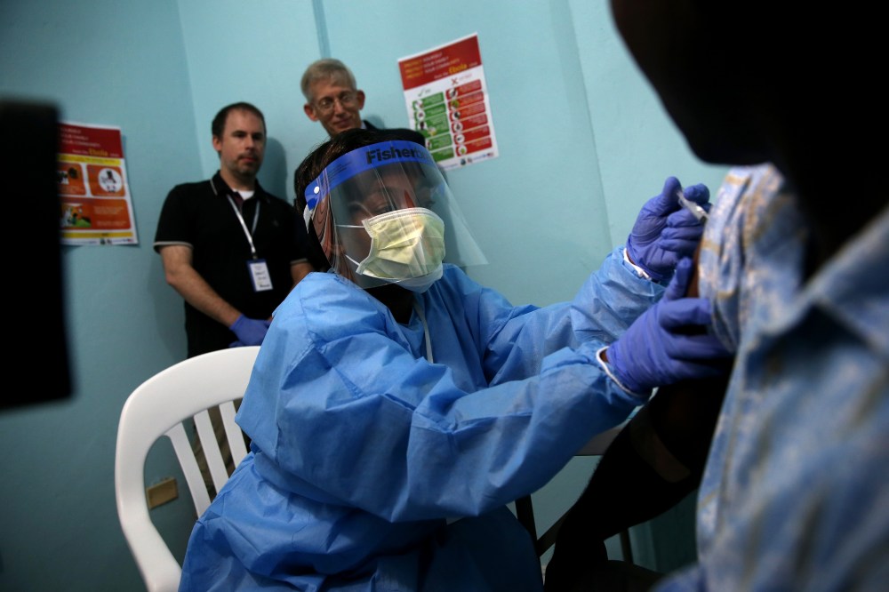 A nurse administers an injection to Emmanuel Lansana, 43, the first person to take part in the Ebola vaccine trials being conducted at Redemption Hospital, formerly an Ebola holding center, on Feb. 2, 2015 in Monrovia, Liberia. (Photo by John Moore/Getty)