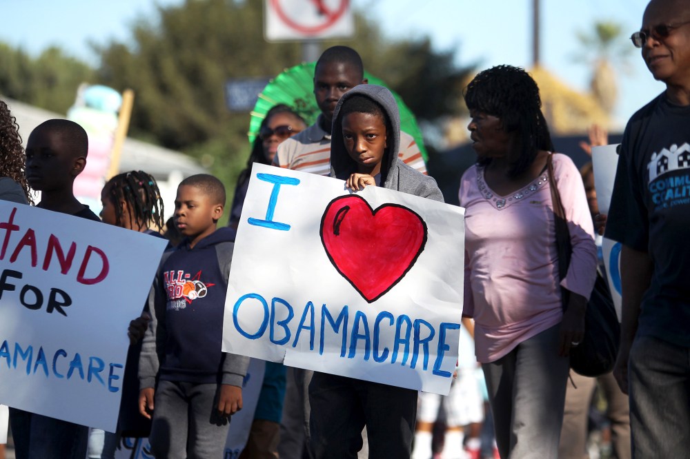 Supporters of the Affordable Care Act march in the 29th annual Kingdom Day Parade on January 20, 2014 in Los Angeles, California.