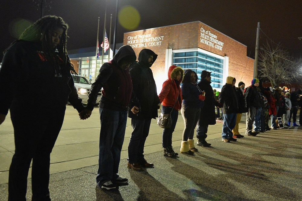 Protestors demonstrate outside the Ferguson Police Department in Ferguson, Missouri on March 4, 2015. (Photo by Michael B. Thomas/Getty)