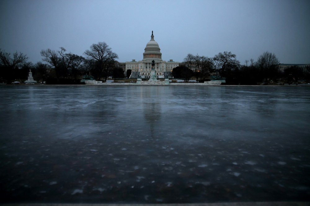 The Capitol Reflecting Pool is frozen in front of the U.S. Capitol on Jan. 28, 2014 in Washington, DC.