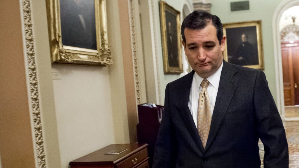 Ted Cruz walks to participate in a cloture vote, Feb. 12, 2014.