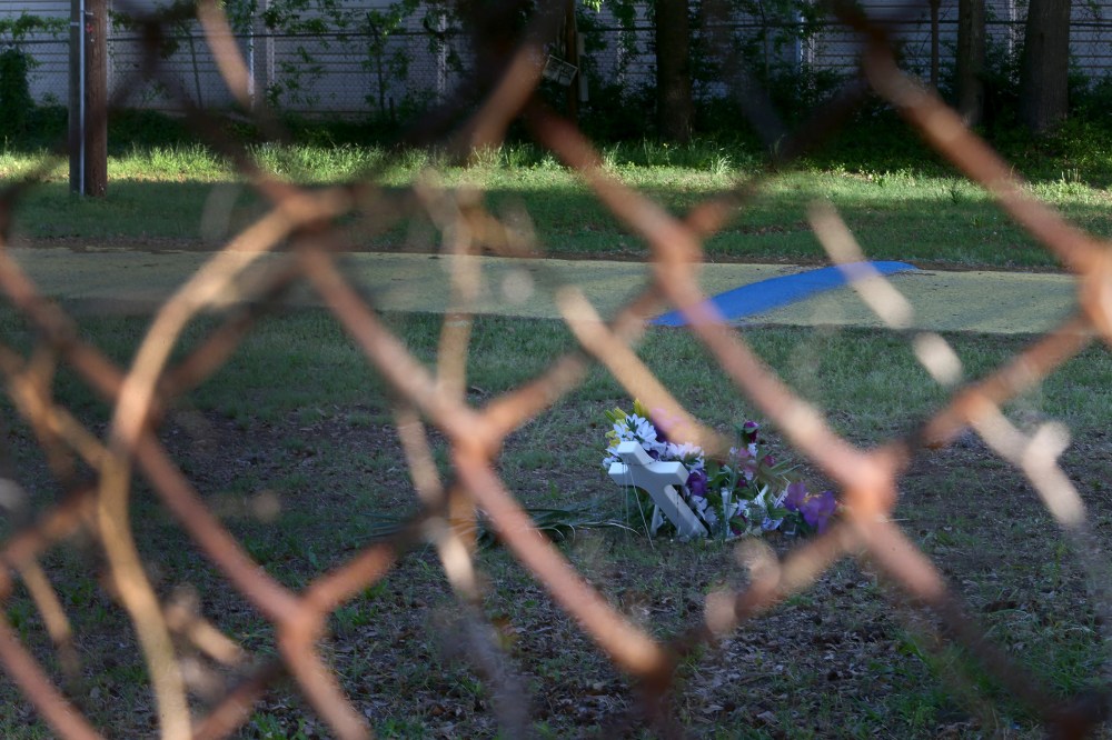 A memorial is seen through a fence marking the site where Walter Scott was killed on April 4th by a North Charleston police officer on April 10, 2015 in North Charleston, S.C.