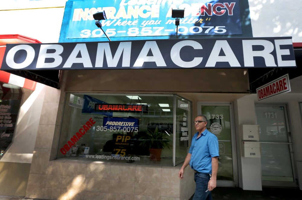 Hisham Uadadeh walks out of Leading Insurance Agency after enrolling in a health insurance plan under the Affordable Care Act on February 13, 2014 in Miami, Florida.