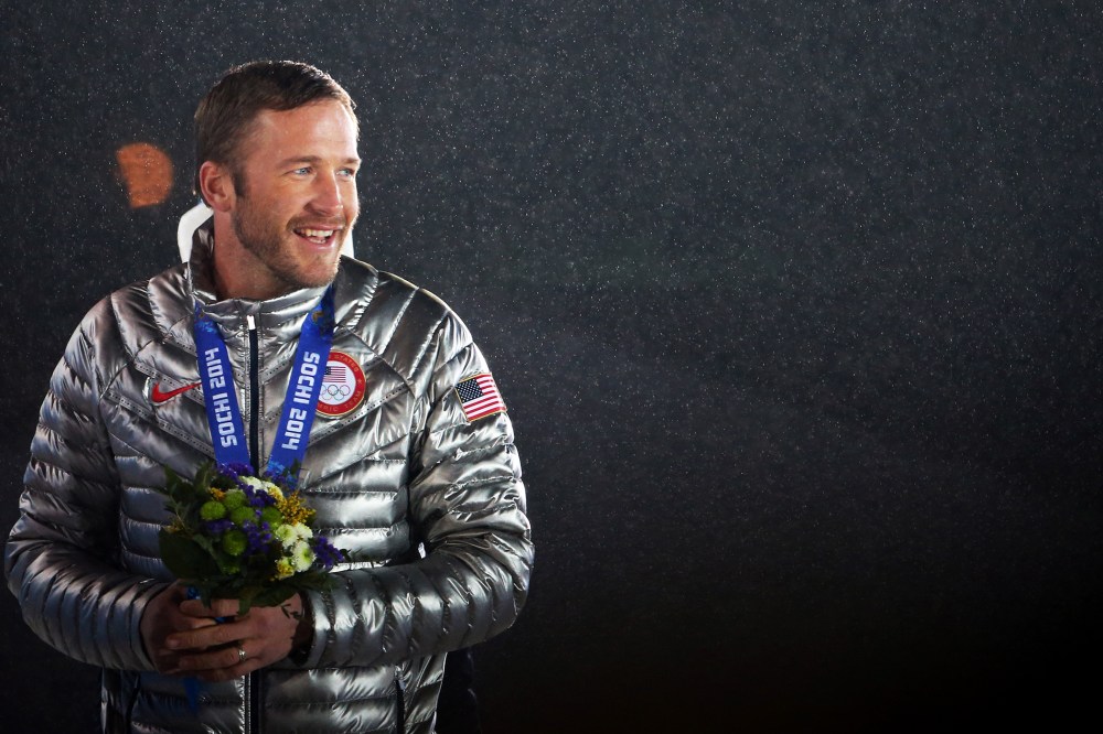 Joint bronze medalist Bode Miller of the United States celebrates on the podium, Feb. 16, 2014.