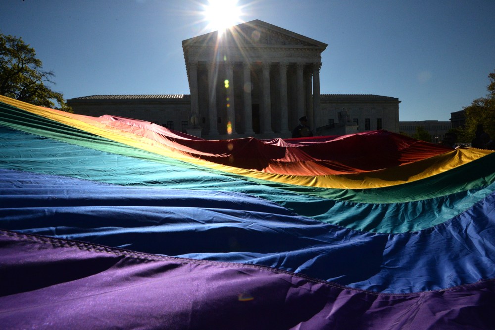 Supporters of same-sex marriages gather outside the US Supreme Court waiting for its decision on April 28, 2014 in Washington, D.C. (Photo by Mladen Antonov/AFP/Getty)
