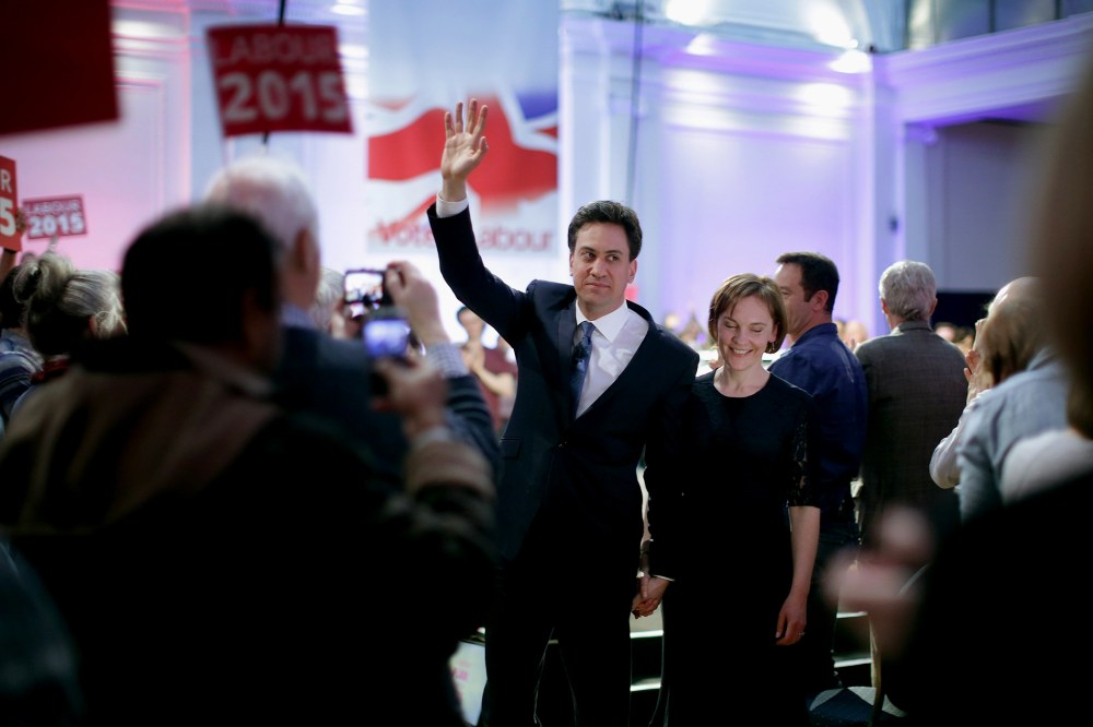 Labour leader Ed Miliband waves goodbye to supporters as he and his wife Justine Thornton leave a campaign rally at the Royal Horticultural Halls on May 2, 2015 in London, United Kingdom. (Photo by Chip Somodevilla/Getty)