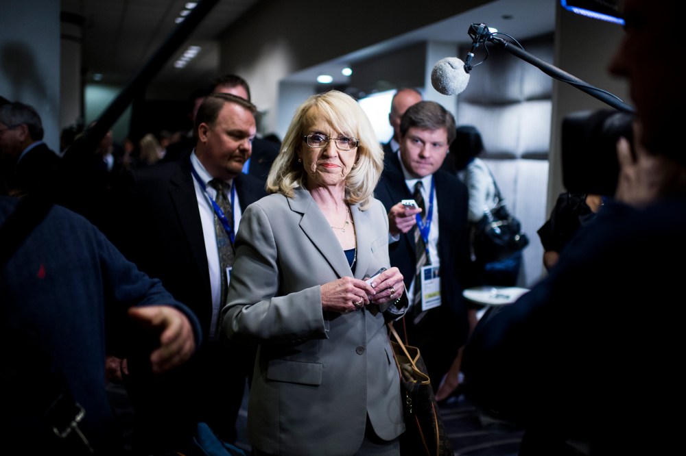 Jan Brewer walks through the National Governors Association Winter Meeting, Feb. 22, 2014.