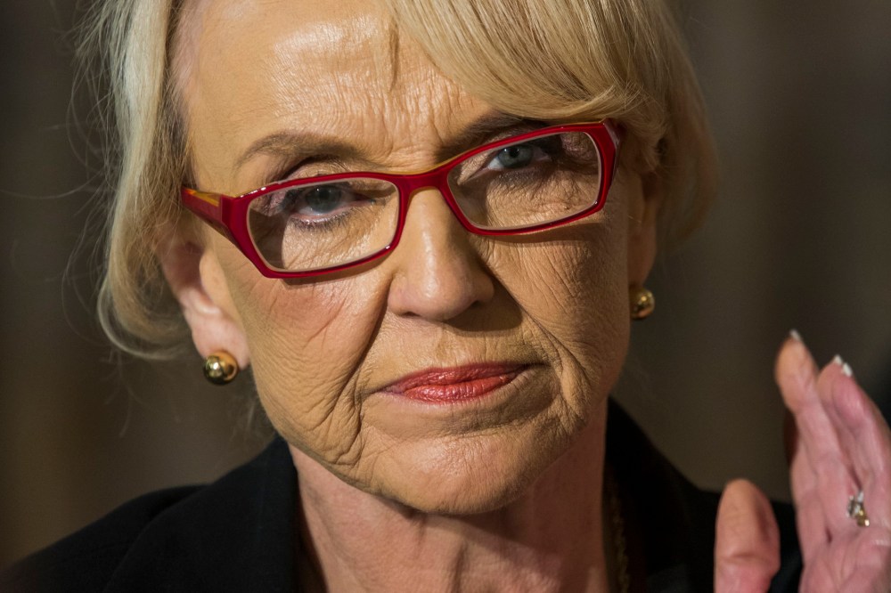 Arizona Gov. Jan Brewer listens to US President Barack Obama speak to the National Governors Association in the State Dining Room of the White House Feb. 24, 2014 in Washington, DC.