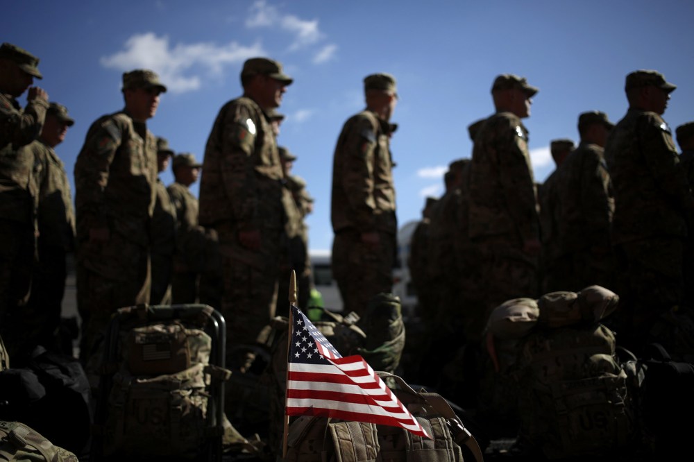 An American flag flies from the rucksack of a soldier outside a homecoming ceremony at Fort Knox on Feb. 27, 2014 in Fort Knox, Ky.