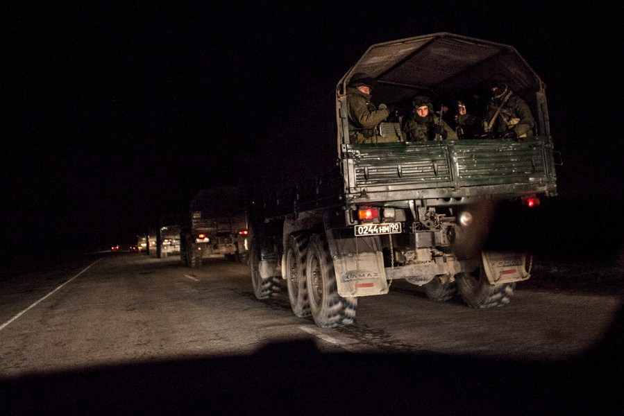 A convoy of 20 Russian armored personnel carriers and trucks full of troops are seen 3km from Simferopol of Crimea, where they are reportedly heading, on February 28, 2014.