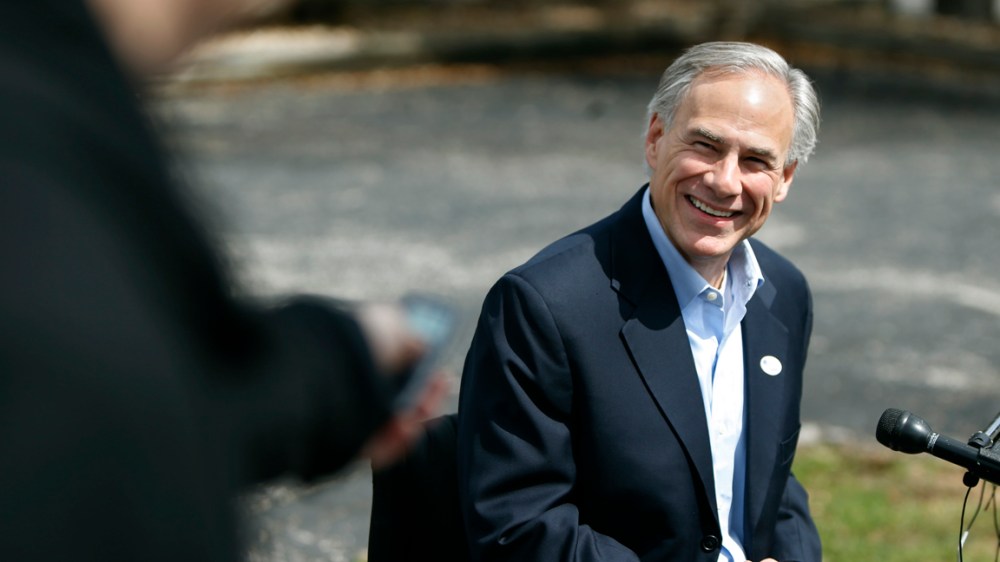 Texas Attorney General Greg Abbott speaks to the press after voting in the Texas primary in Austin, March 4, 2014.