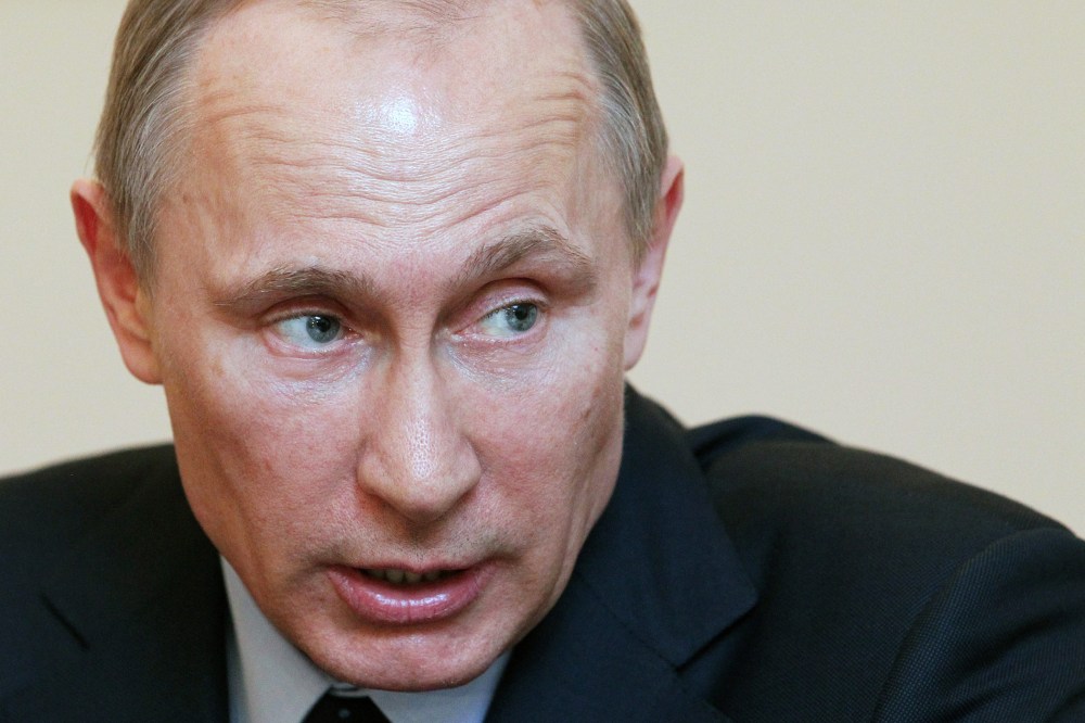 Russian President Vladimir Putin attends the Summit of Eurasian Economic Cooperation Council, March 5, 2014.