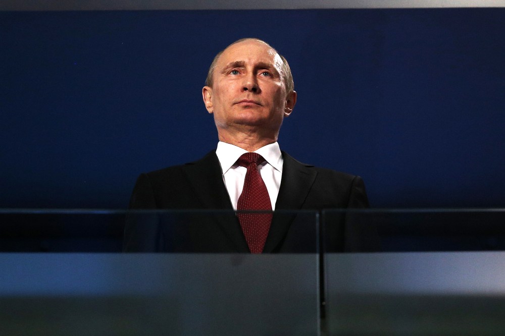 Russian President Vladimir Putin watches the Sochi 2014 Paralympic Winter Games Closing Ceremony, March 16, 2014 in Sochi, Russia.