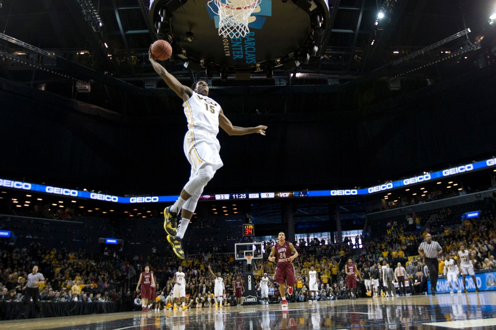 VCU Forward Juvonte Reddic dunks the ball against the St. Joseph's Hawks on March 16, 2014 at the Barclays Center in Brooklyn. N.Y.