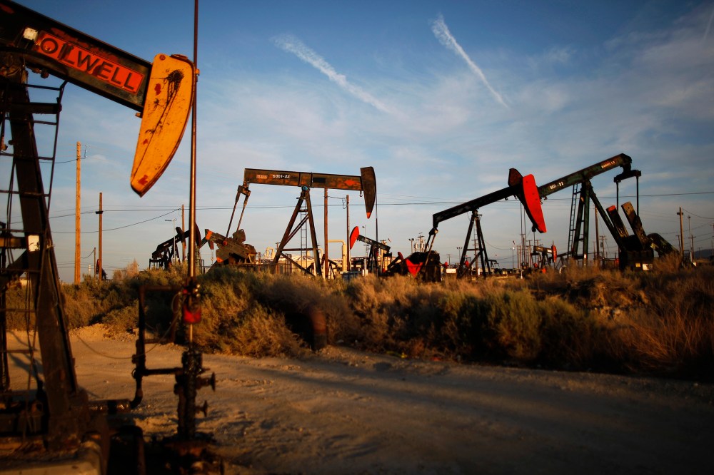 Pump jacks and wells are seen in an oil field on the Monterey Shale formation where gas and oil extraction using hydraulic fracturing, or fracking, is on the verge of a boom on March 23, 2014 near McKittrick, Calif. (Photo by David McNew/Getty)
