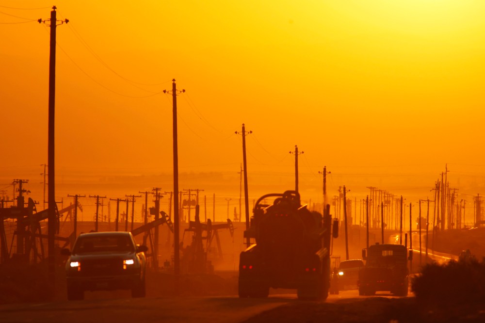 Traffic near an oil field over the Monterey Shale formation, where gas and oil extraction using hydraulic fracturing is on the verge of a boom, near Lost Hills, California, March 24, 2014.