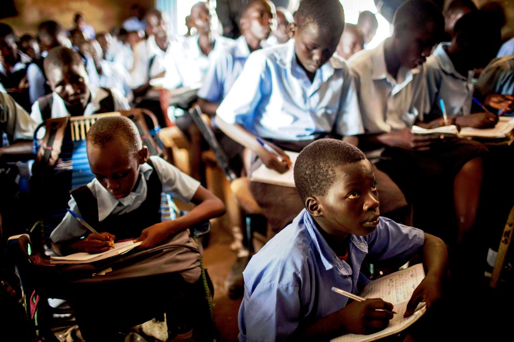 Students take notes during an English language class at the Juba Nabari Primary School, in Juba on April 9, 2014.