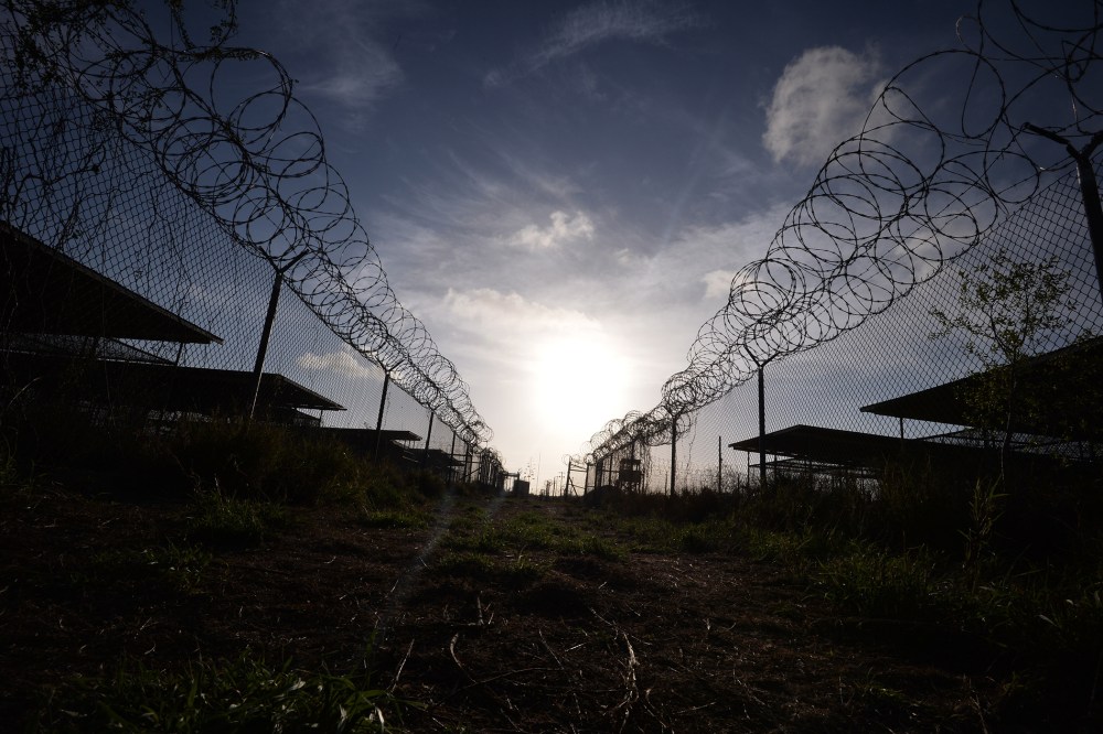 This photo made during an escorted visit and reviewed by the US military, shows the razor wire-topped fence at the abandoned "Camp X-Ray" detention facility at the US Naval Station in Guantanamo Bay, Cuba April 9, 2014. (Photo by Mladen Antonov/AFP/Getty)