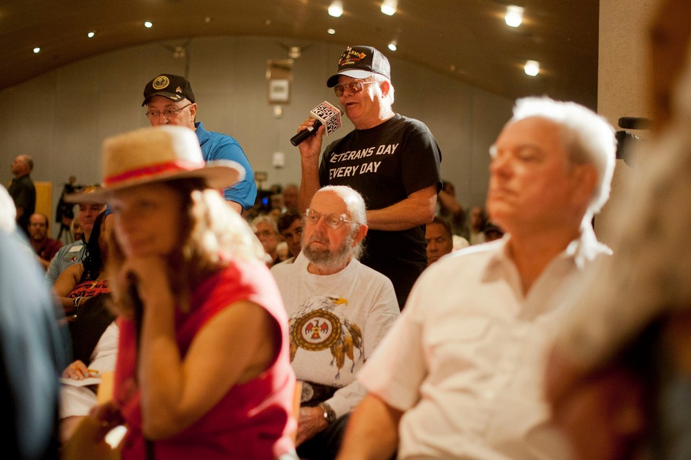 Veterans addresses Sen. John McCain at a forum in Phoenix, Arizona to discuss mismanagement of Veterans Affairs, May 9, 2014.