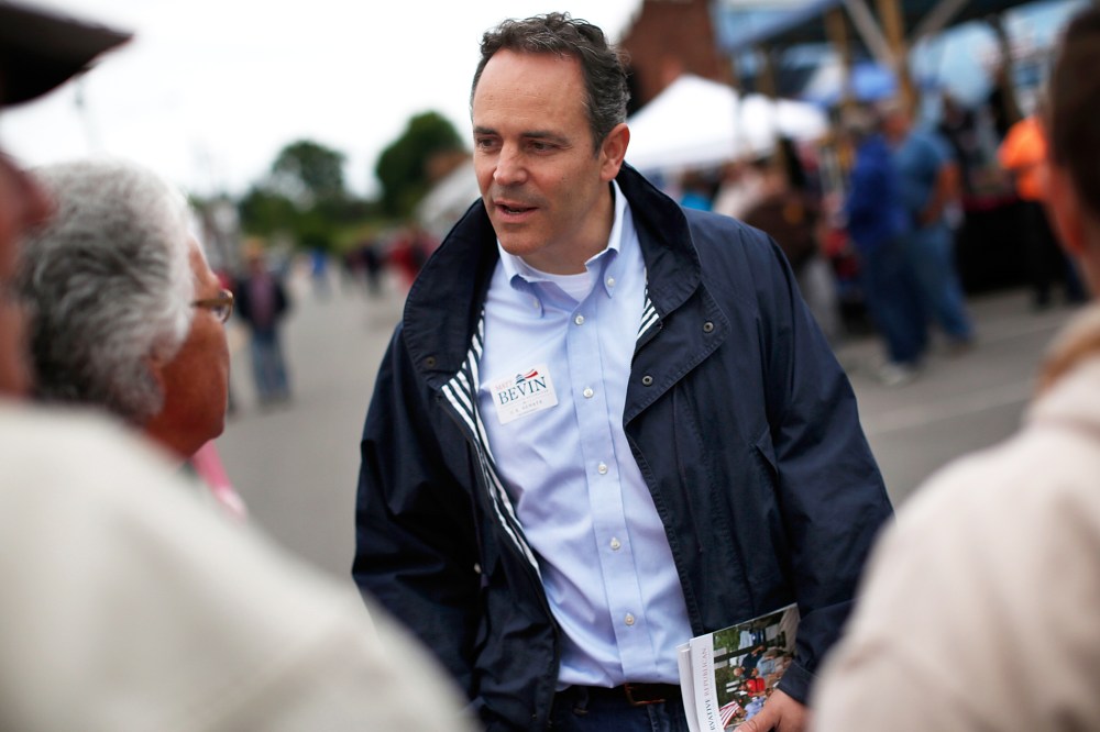 Then, Kentucky Republican senatorial candidate Matt Bevin talks with voters at the Fountain Run BBQ Festival while campaigning for the Republican primary May 17, 2014 in Fountain Run, Ky. (Photo by Win McNamee/Getty)