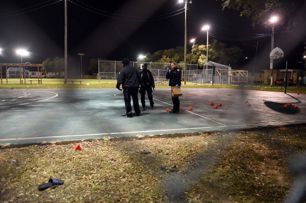 Police gather evidence after a shooting at a playground on Nov. 22, 2015 in New Orleans, La. (Photo by Cheryl Gerber/Getty)