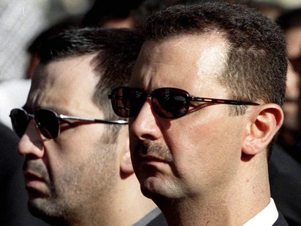 DAMASCUS, SYRIA:  The sons of Syria's late President Hafez al-Assad, Maher (L) and heir apparent, Bashar (R), march behind their father's coffin during his funeral in Damascus 13 June 2000. Assad, who ruled his country with an iron fist for 30 years,...