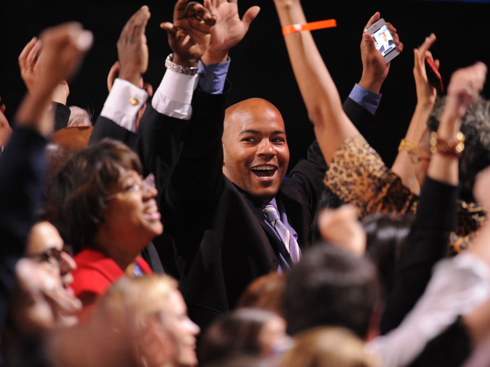 US President Barack Obama supporters celebrate as CNN projected The President re-elected on election night November 6, 2012 in Chicago, Illinois.  (Photo by ROBYN BECK/AFP/Getty Images)
