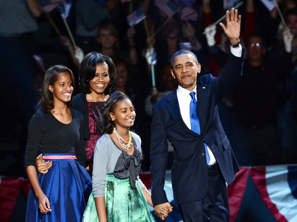 U.S. President Barack Obama and family arrive on stage after winning the 2012 US presidential election November 7, 2012 in Chicago, Illinois.  Obama swept to re-election, forging history again by defying the dragging economic recovery and high...