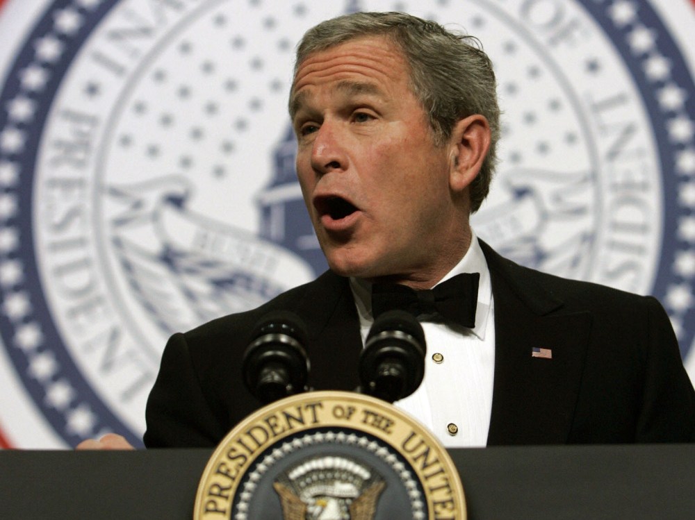 File Photo: US President George W. Bush addresses the Texas Wyoming Ball, part of the festivities marking his inauguration for a second term, in Washington 20 January 2005. (Photo by Brendan Smialowski/AFP/Getty Images, File)