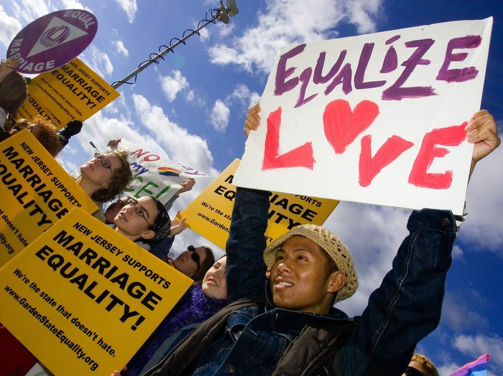 File Photo: Supporters await the New Jersey Supreme court decision on same-sex marriage in front of the Supreme court building on  October 25, 2006 in Trenton, New Jersey. New Jersey's highest court guaranteed gay couples the same rights as married...